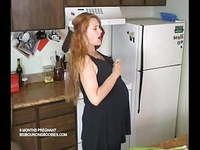 6 months pregnant in her kitchen